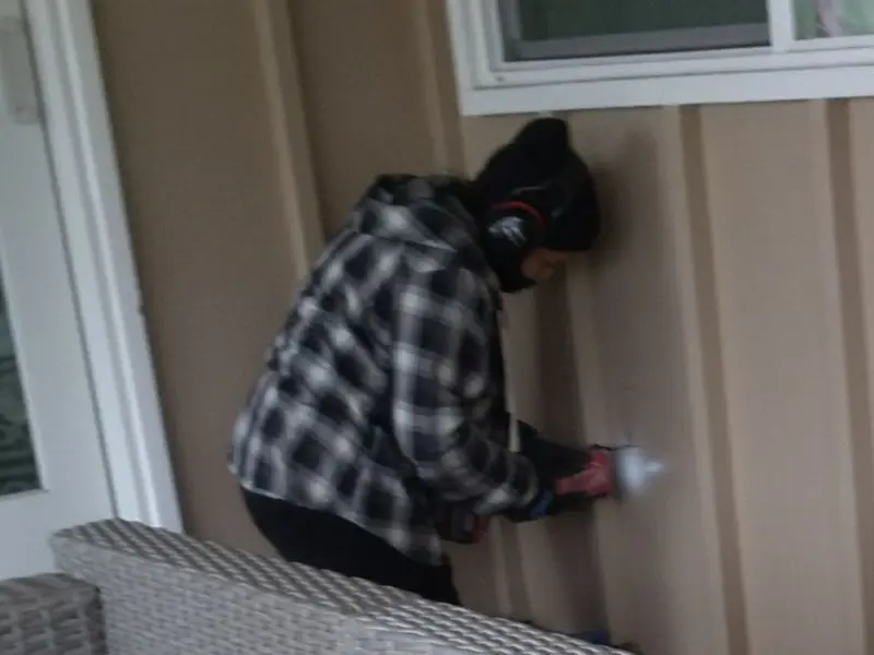 Professional electrician installing an exterior outlet in Saltillo